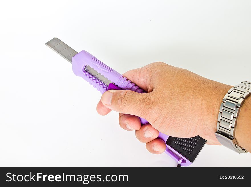 The purple cutter in a man's hand. The purple cutter in a man's hand