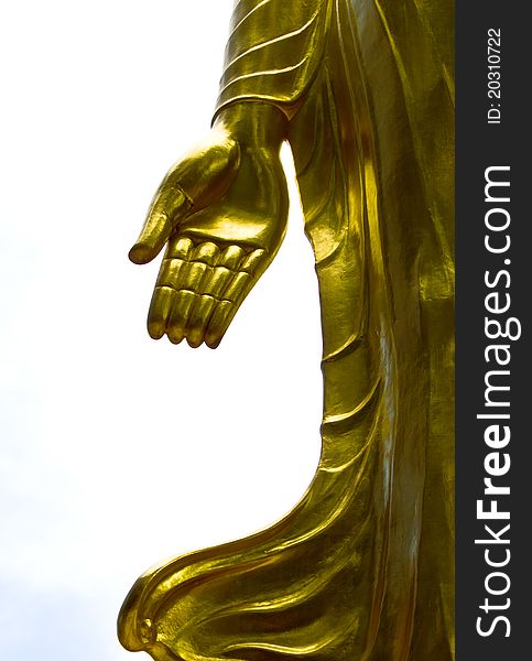 The golden hand of Buddha standing in a temple of Thailand. The golden hand of Buddha standing in a temple of Thailand.