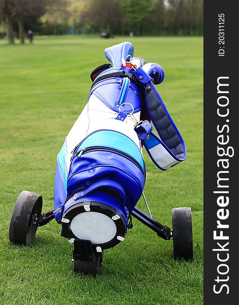 Image of a blue golf bag on the green this image was taken on a cloudy day but bright day in july