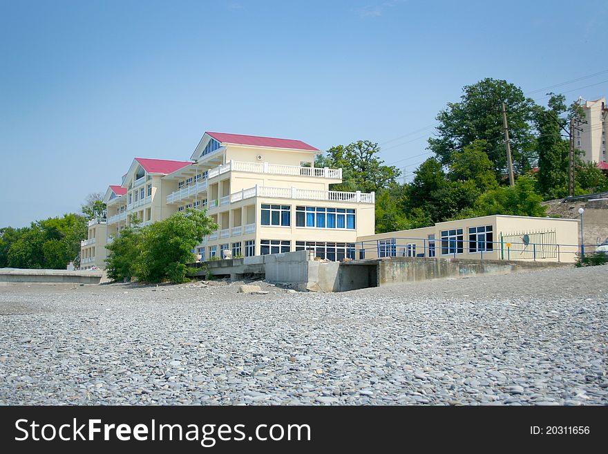 Abstract scene with hotel on the sea beach. Abstract scene with hotel on the sea beach