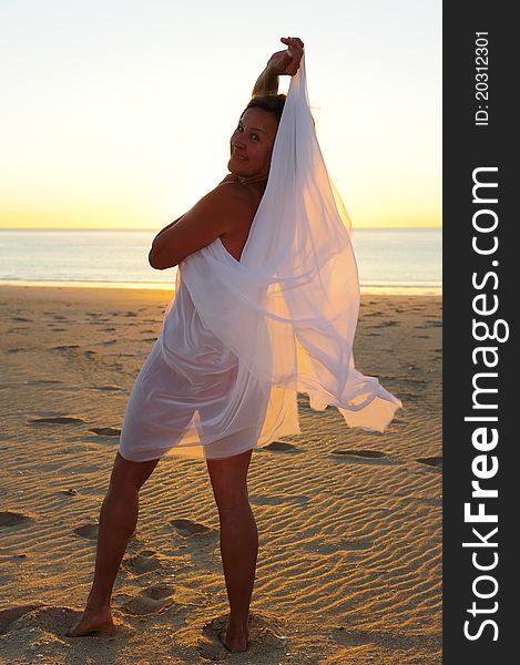 Mature Woman Beach At Sunset