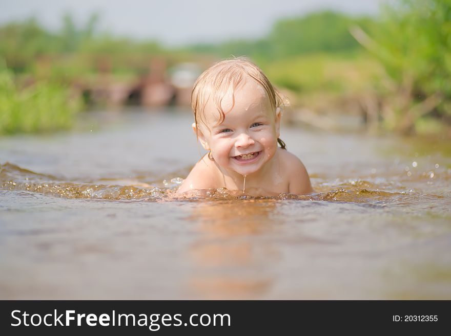 Adorable Young Baby Swim In River