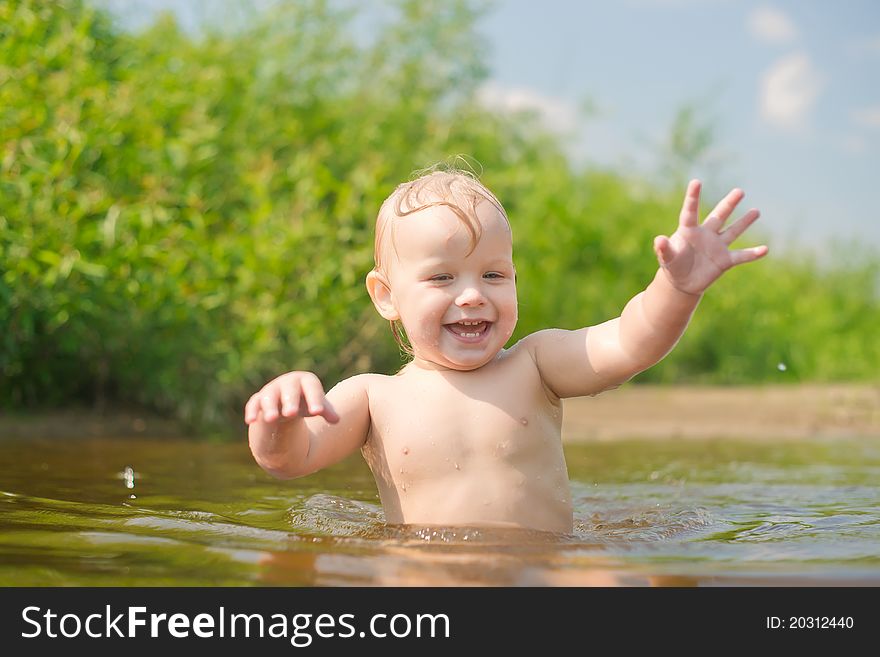 Adorable baby walk in river water. Adorable baby walk in river water