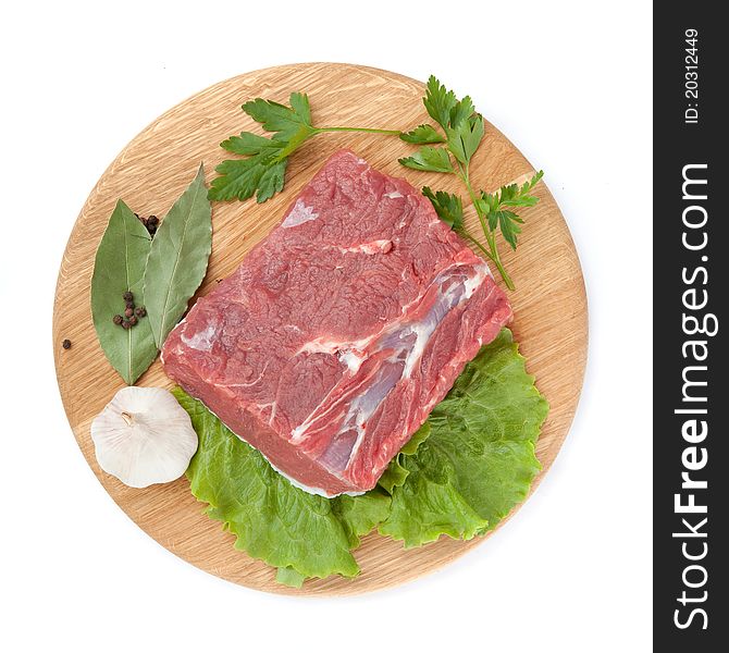 Fresh raw beef steak meat on cutting board in closeup over white background