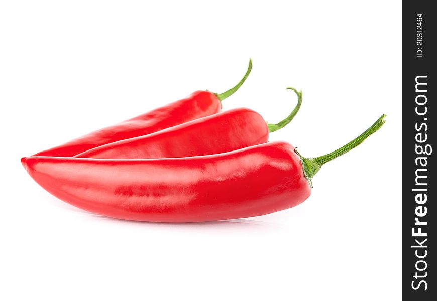 Three red hot chili pepper isolated on a white background