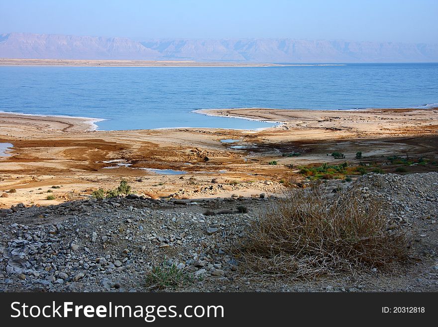 Dead Sea coast, Dead Sea is the lowest place in the world, And where it is called the Jordan Valley, Filled with salt water, Many mineral elements which exist in abundance, dissolved in its water, Also called the Sea of Lot