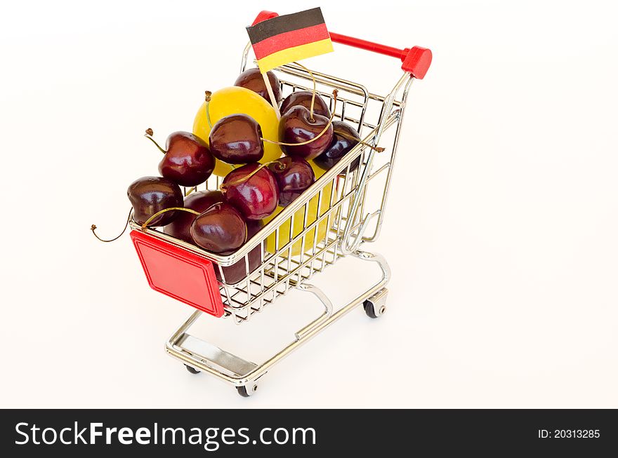 Red shopping cart with plum and cherry