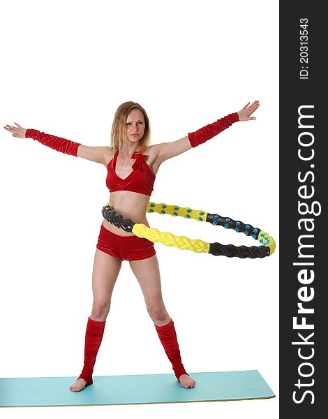 Young gymnast girl doing exercises with hula-hoop. Young gymnast girl doing exercises with hula-hoop