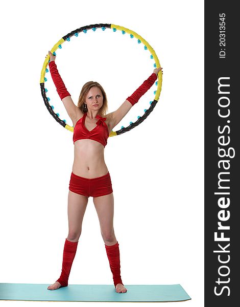 Young gymnast girl doing exercises with hula-hoop. Young gymnast girl doing exercises with hula-hoop