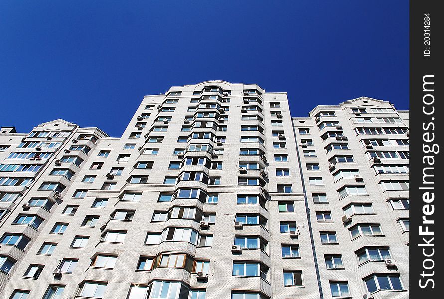 Modern apartment house against the sky in a city.