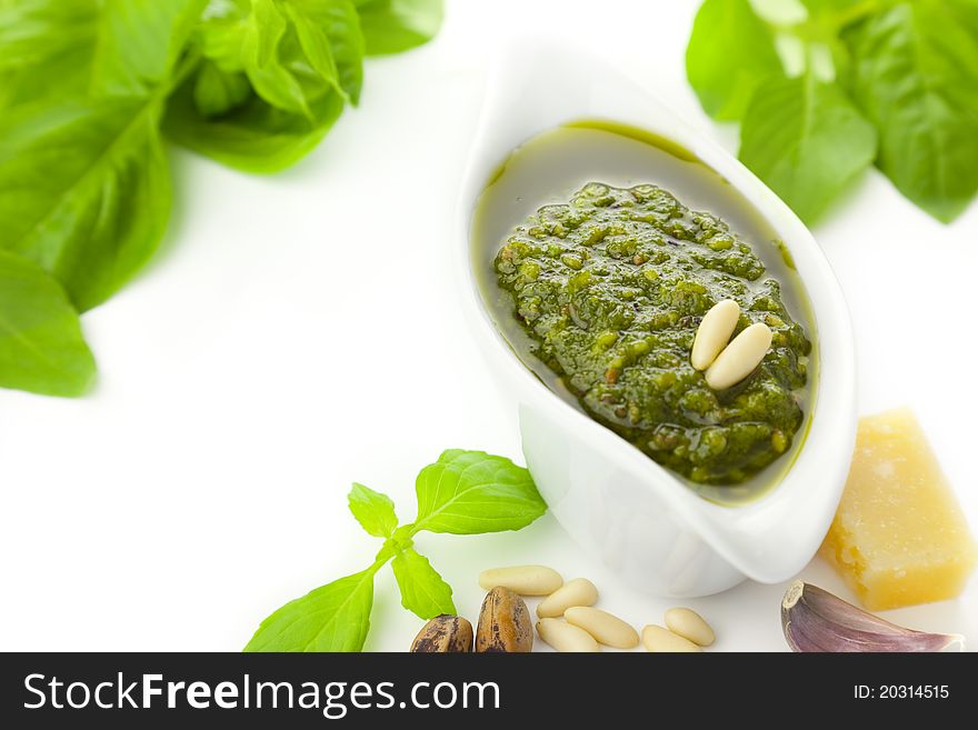 Fresh Pesto and its ingredients / isolated on white