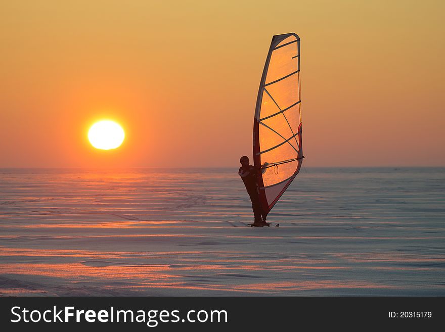 Ice sailing at sunset on a frozen sea in Estonia. Ice sailing at sunset on a frozen sea in Estonia.