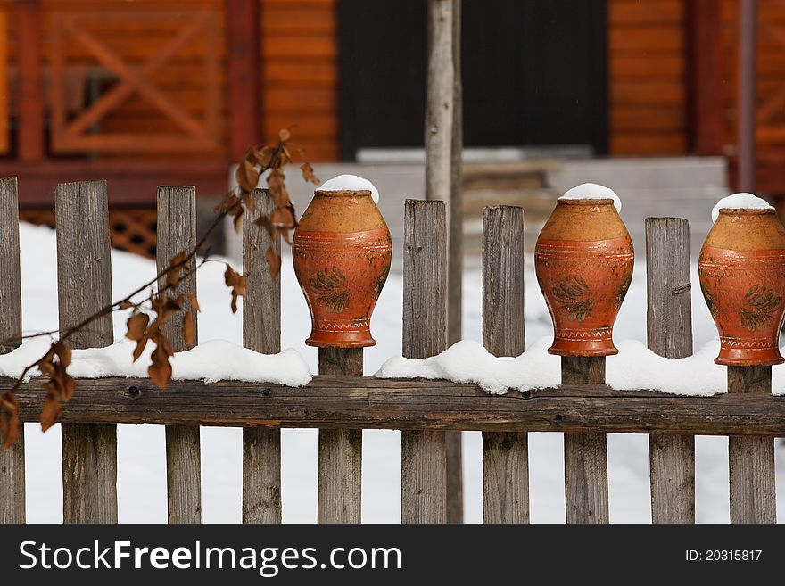 Clay Pots Put Up On A Wooden Fence