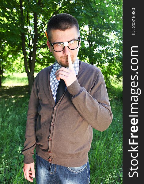 Nerd man outdoor with funny face in glasses. Nerd man outdoor with funny face in glasses