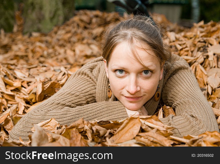 Woman in Fall Leaves