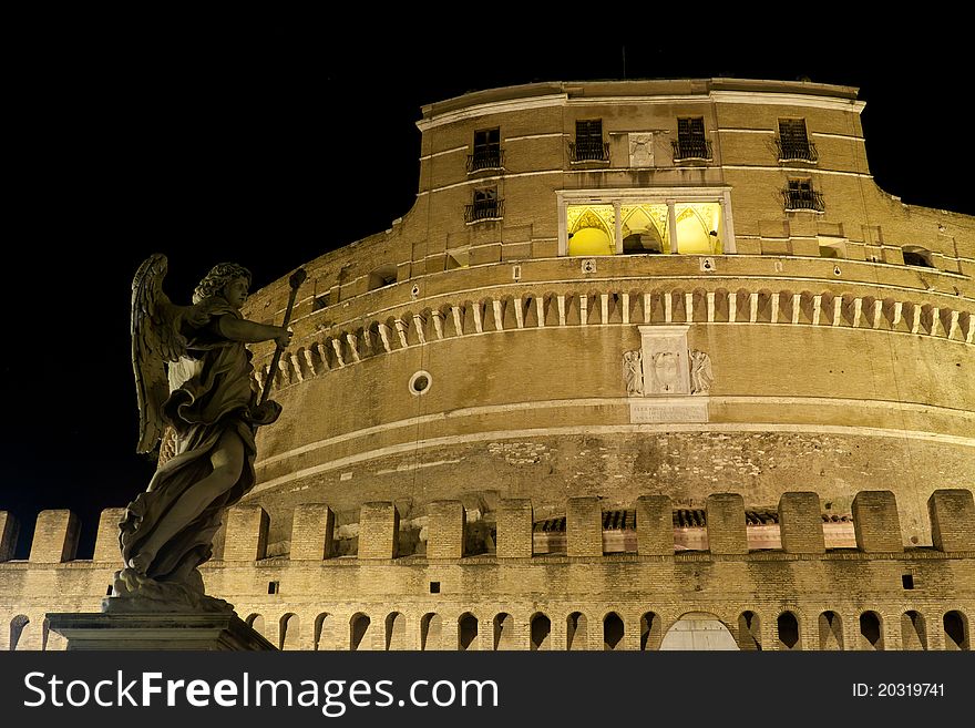 Castel Sant'Angelo in rome shot at night with a statue. Castel Sant'Angelo in rome shot at night with a statue