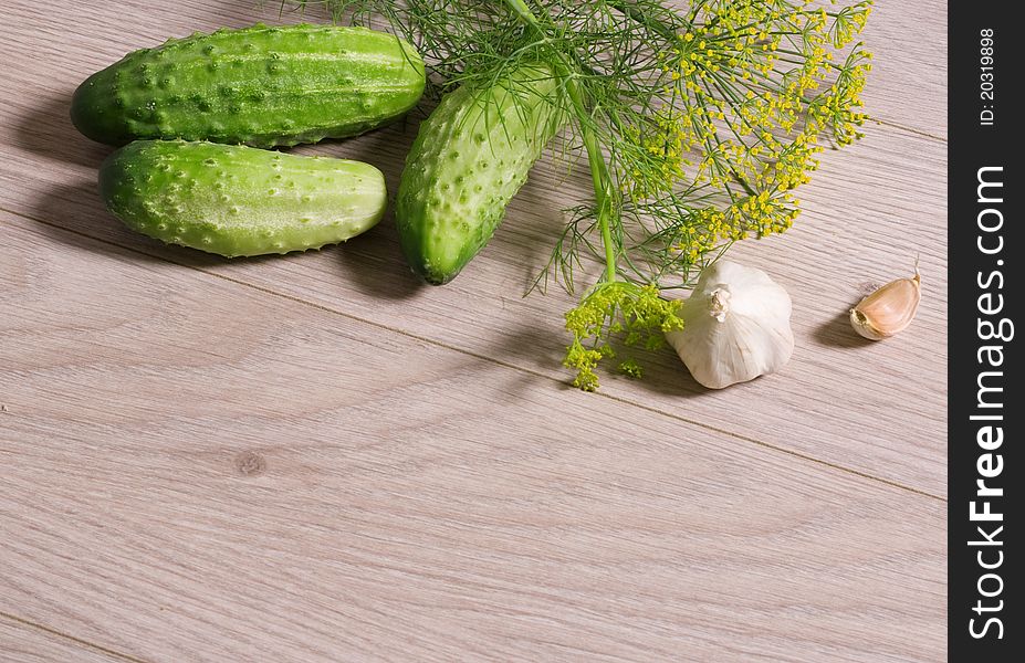 Fresh Cucumbers On A Wooden Table