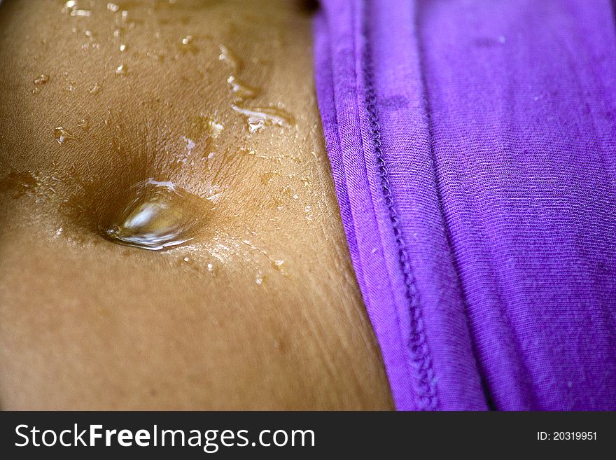 Woman's belly wet with water. Woman's belly wet with water