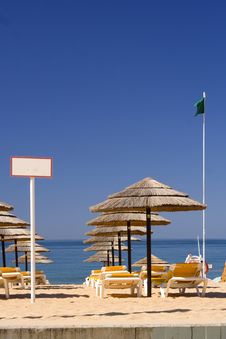 EDZR - Beach Umbrellas And Green Flag Royalty Free Stock Photography EDZR - Beach Umbrellas And Green Flag Royalty Free Stock Photography
