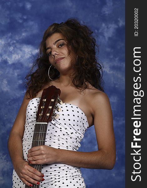 Woman poising with guitar music. Woman poising with guitar music