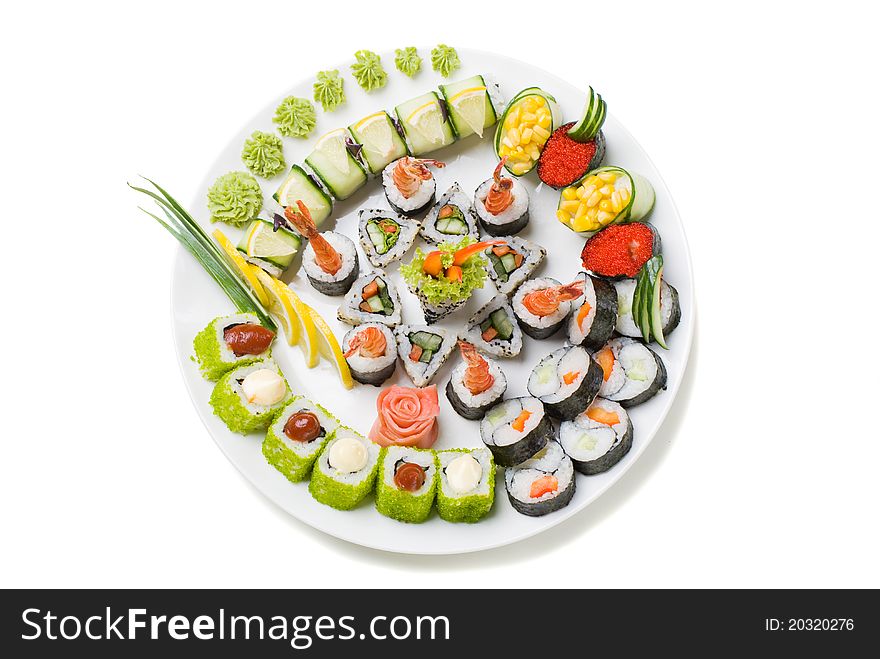 Photo of a rolled and sushi on the white plate