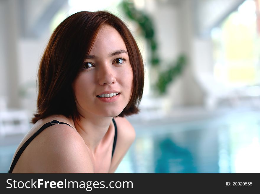 Portrait of a smiling girl in a swimming pool. Portrait of a smiling girl in a swimming pool