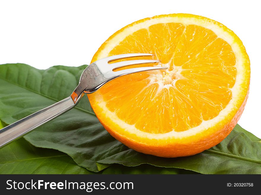 Cut orange with a plug on a lemon leaves isolated on a white background