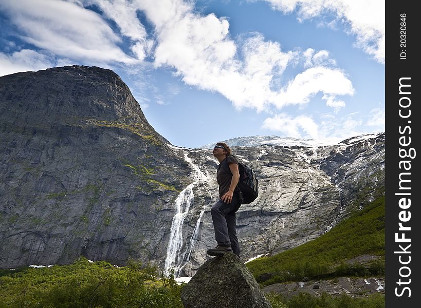 Sport girl in the mountains looks ahead. Sport girl in the mountains looks ahead