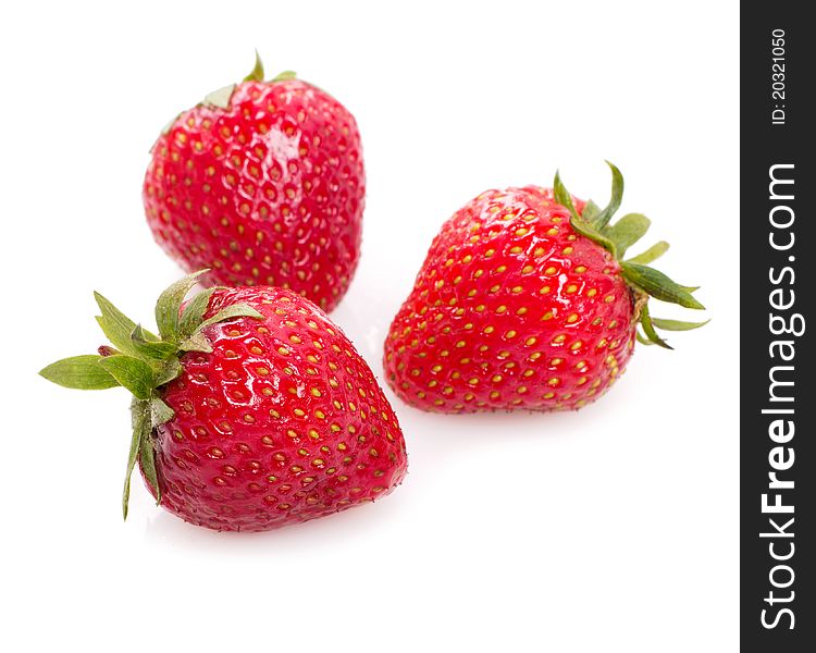 Three sweet strawberry isolated on white