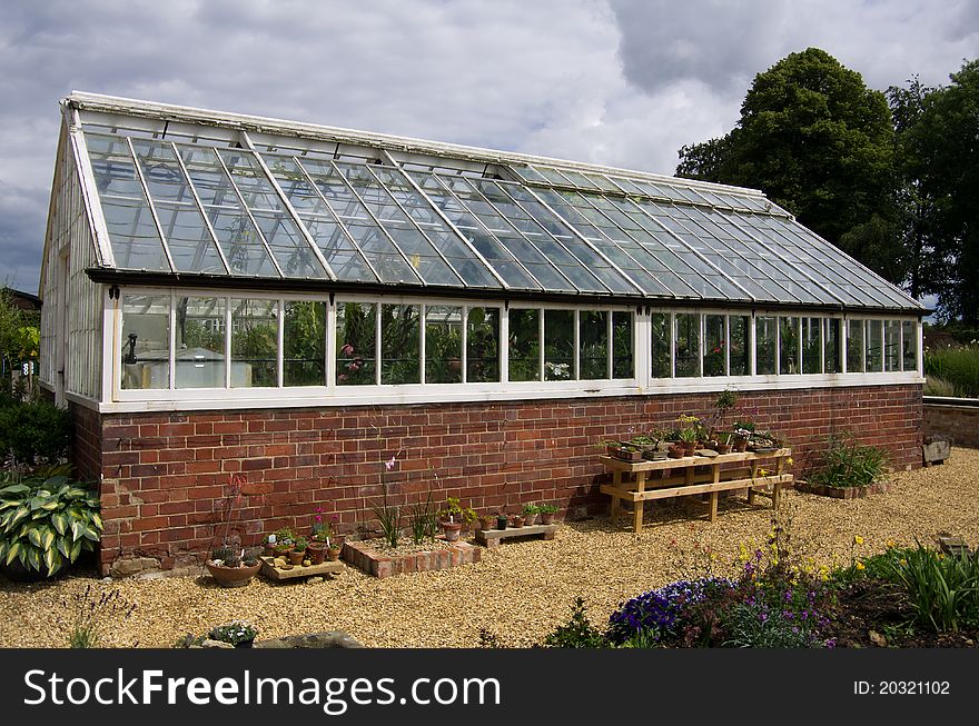 A commercial greenhouse in a garden centre. A commercial greenhouse in a garden centre