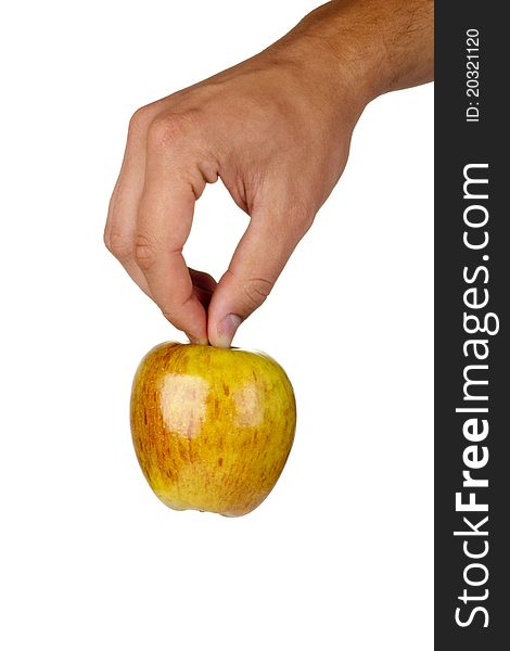 Fuji apple in a hand isolated on a white background.