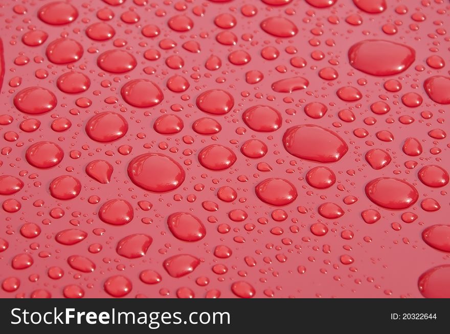 Water droplet on red color polishing surface. Water droplet on red color polishing surface