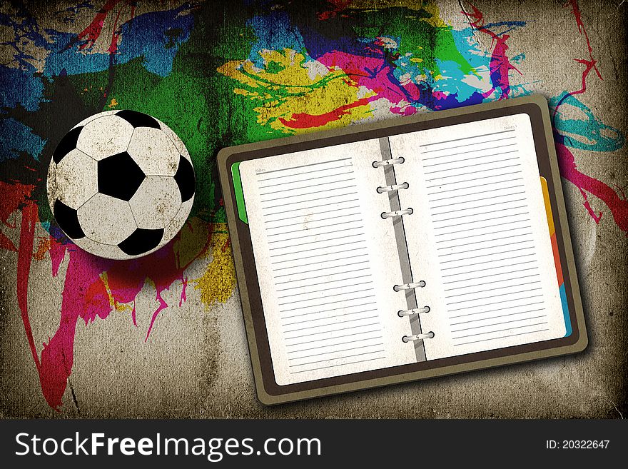 Football and blank notebook on vintage background