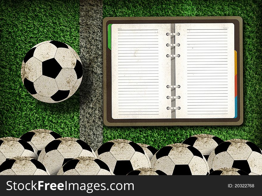 Football and blank notebook on Green Grass background