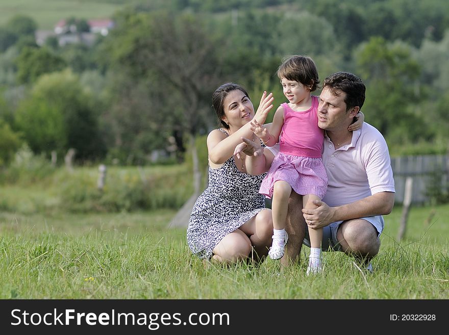 Beautiful young family posing in summer season. Beautiful young family posing in summer season