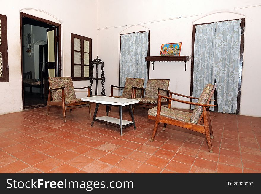 An old traditional indian house with furniture on display. An old traditional indian house with furniture on display
