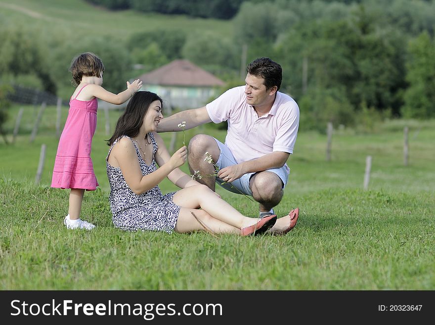 White Family Relaxing In Nature