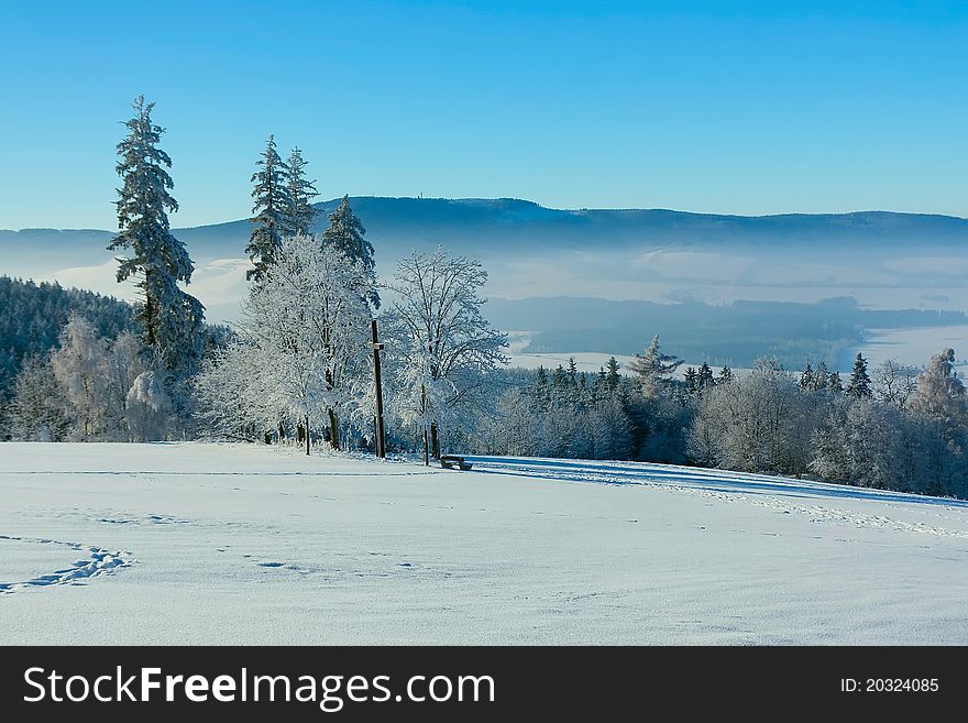 View of the snowy landscape and small town Kraliky on the border of Poland and the Czech Republic (Eastern Europe)