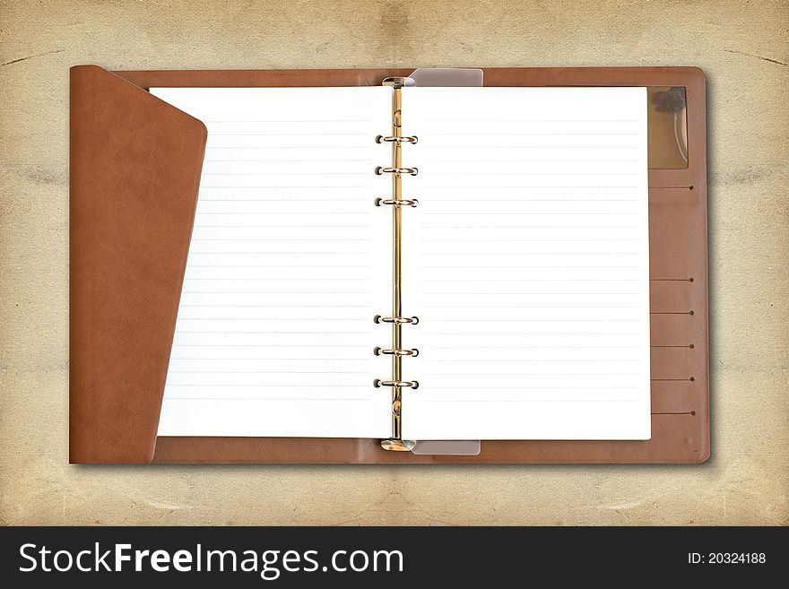 Blank Spiral Notebook on vintage background