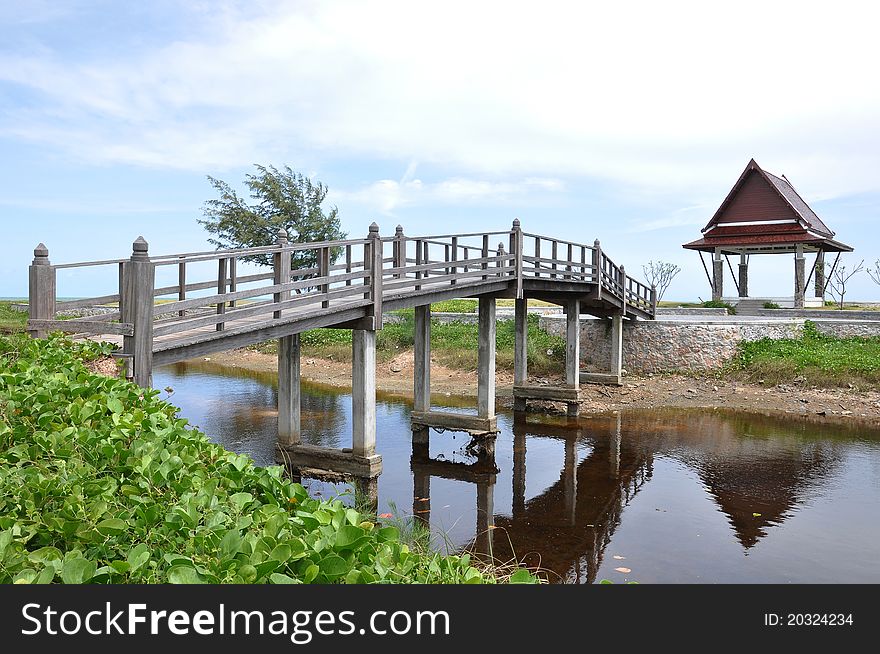 Wooden bridge at garden with blue sky