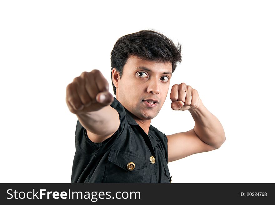 Angry Indian man in attacking position in extreme rage over white background