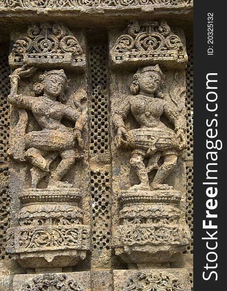 Exquisitely carved wall panel depicting ladies dancing and also beating the drum at Sun Temple, Konark, Orissa, India, Asia. Exquisitely carved wall panel depicting ladies dancing and also beating the drum at Sun Temple, Konark, Orissa, India, Asia