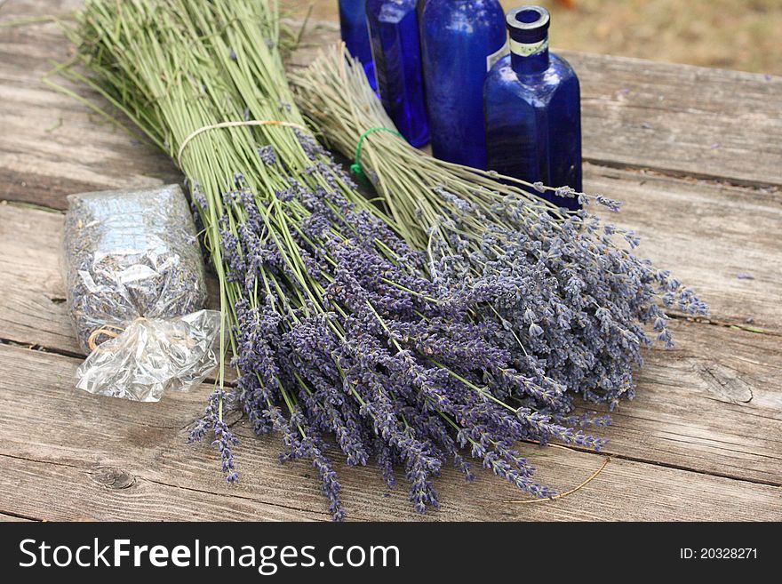 Bottles, seeds, fresh cut bundles of lavender farm in provence