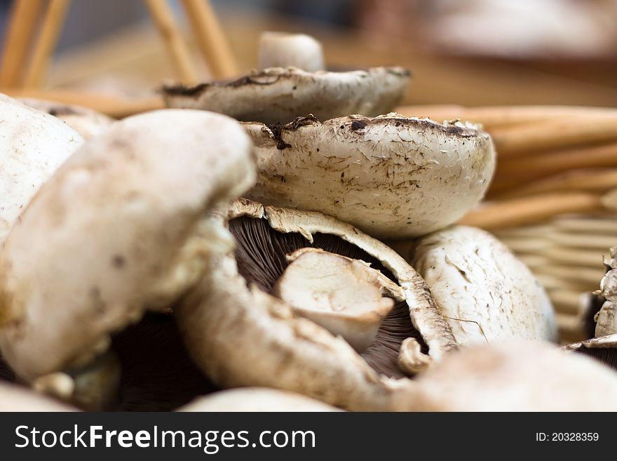 A few portabello mushrooms in a basket