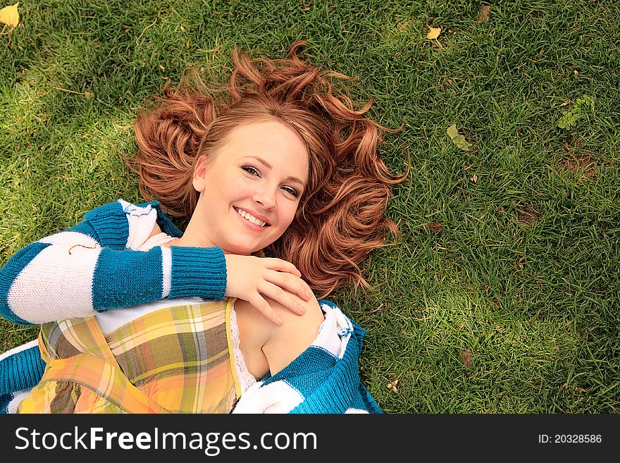 Girl enjoying laying in the grass. Girl enjoying laying in the grass