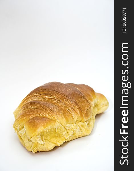 Big and tasty croissant on white background