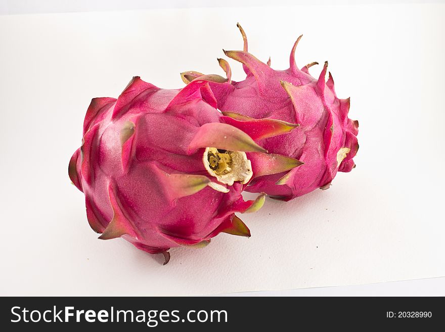 Red organic dragon fruit on white background