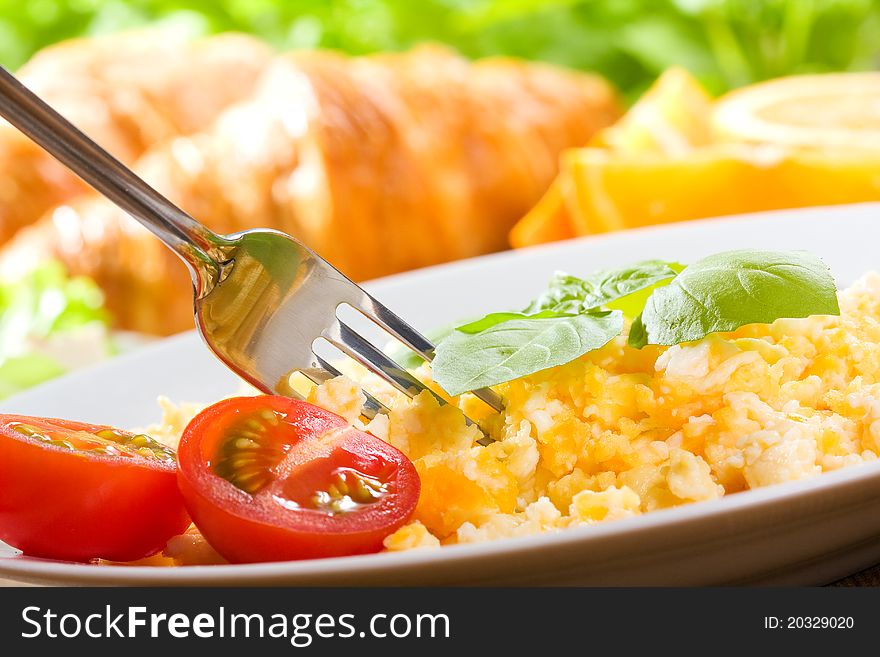 Breakfast with scrambled eggs and vegetables