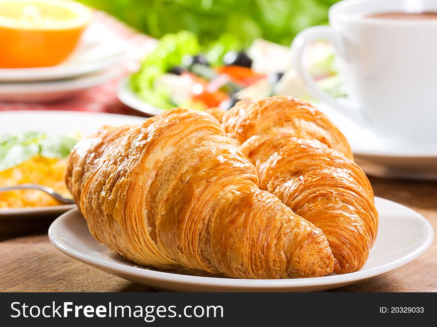 Breakfast with croissants and coffee