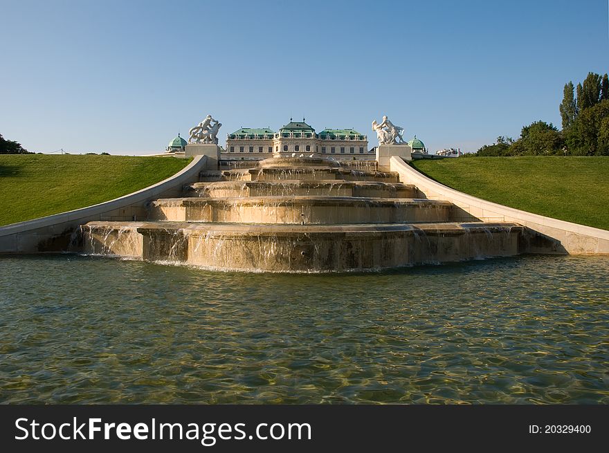 Fountain and Upper Belvedere illuminated with golden sunshine.